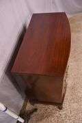Mahogany bowfront bachelor's chest with 4 banded drawers; 68-6623