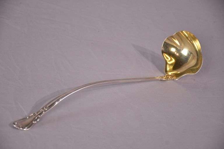 Large sterling silver ladle with gold wash interior; 971-274
