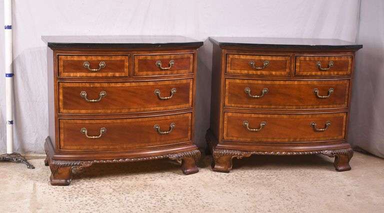 Pair of Universal carved mahogany bowfront bachelor's chests with black marble tops; 68-6869C