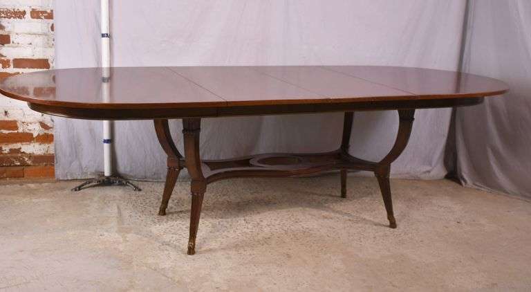 Oval mahogany dining table with 2 skirted leaves; 68-6585A