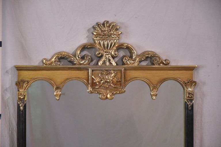 Carolina Mirror Co. large mirror with ornate black and gold frame; 1116-720