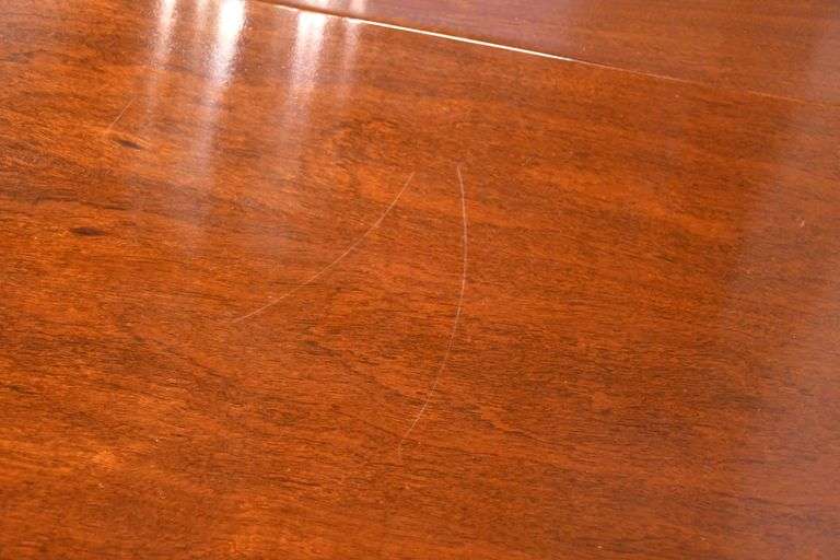 Oval mahogany dining table with 2 skirted leaves; 68-6585A