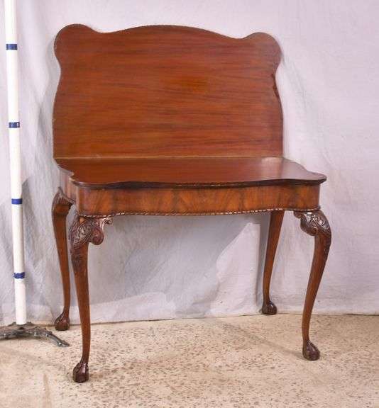 Carved mahogany flip-top table; 74-12753