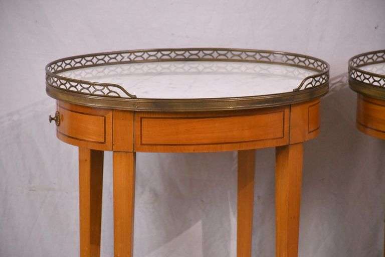 Pair of oval inlaid two-tier single drawer marble top side tables; 68-6885