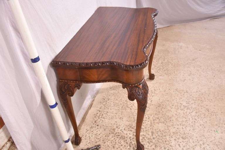 Carved mahogany flip-top table; 74-12753