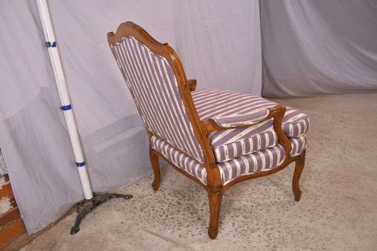 Edward Ferrell Ltd. carved French style open armchair with down cushion; 68-6917