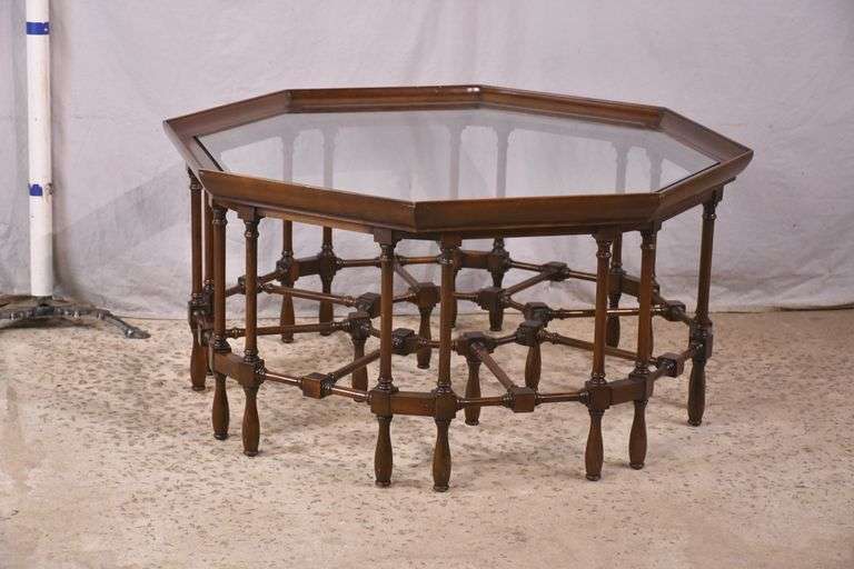 Mahogany octagonal glass top coffee table with cane-cut legs and stretchers; 68-6514