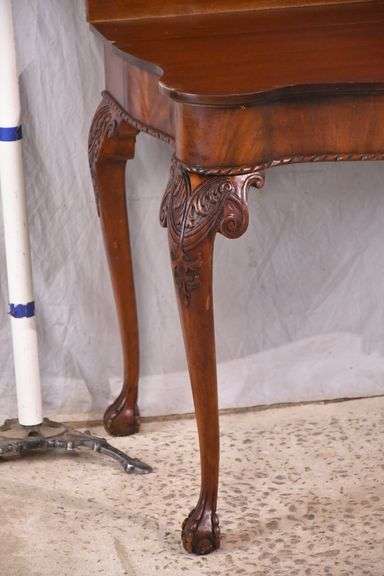 Carved mahogany flip-top table; 74-12753