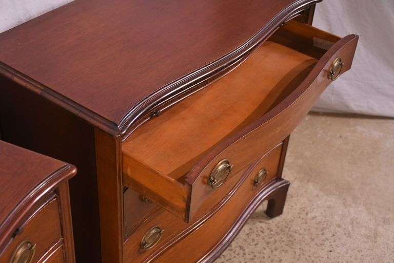 Pair of mahogany serpentine front 4 drawer bachelor's chests with brushing slides; 68-6916