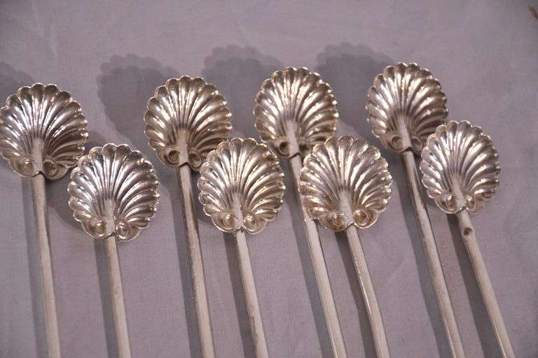 Set of 8 sterling silver shell-shaped sipper stirrers; 971-275