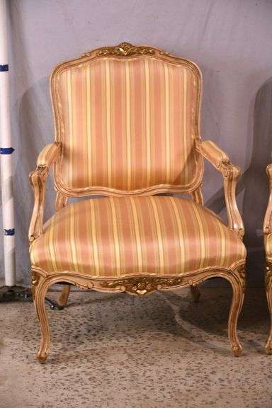 Pair of carved French style open armchairs with striped fabric; 68-6881
