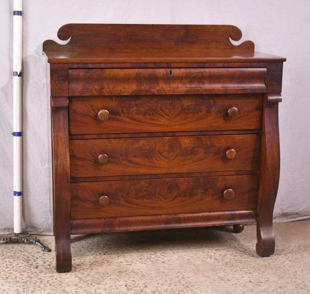 Early crotch mahogany 4 drawer chest with backsplash; 68-6860