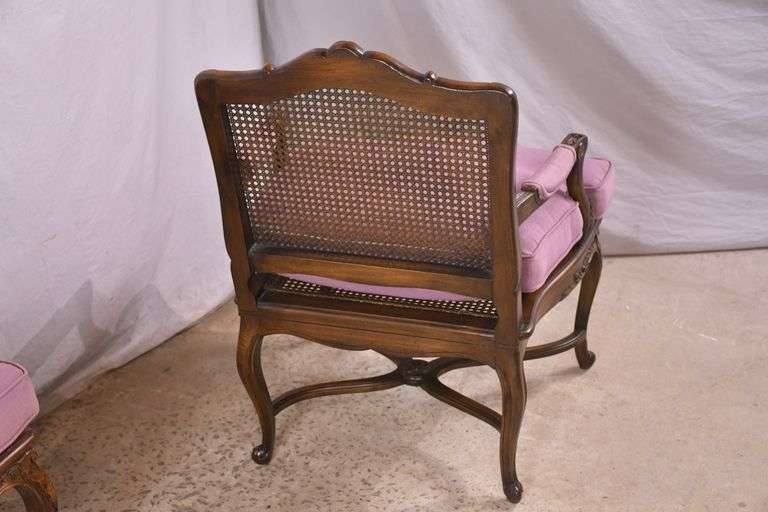 Pair of carved French style open armchairs with cane seats and backs; 68-6922