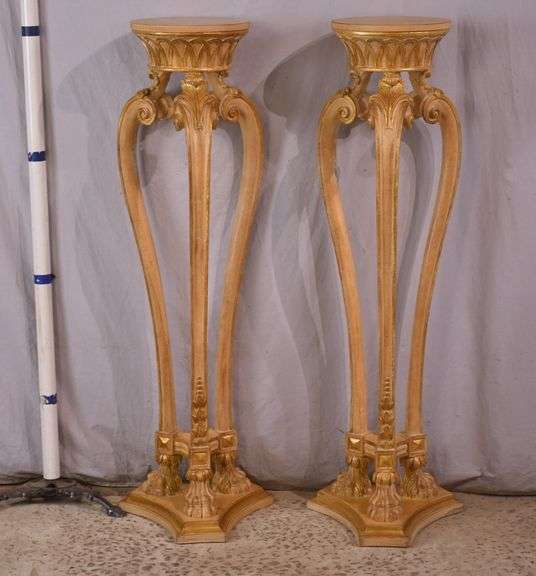Pair of tall carved plant stands with paw feet; 68-6854
