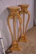 Pair of tall carved plant stands with paw feet; 68-6854