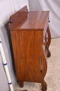 Early crotch mahogany 4 drawer chest with backsplash; 68-6860