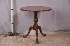 Round mahogany side table with banded top; 68-6846
