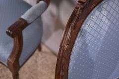 Pair of carved French style open armchairs; 68-6883