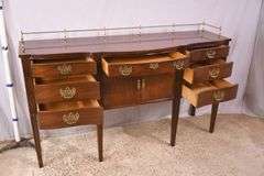 Thomasville cherry serpentine front sideboard with brass rail; 68-6940