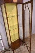 Tall narrow inlaid mahogany curio cabinet; 68-6863