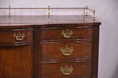 Thomasville cherry serpentine front sideboard with brass rail; 68-6940