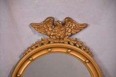 Round porthole mirror with gold eagle frame; 68-6820