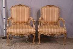 Pair of carved French style open armchairs with striped fabric; 68-6881