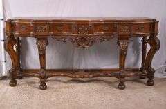 Carved walnut serpentine front 3 drawer sideboard; 74-12809A