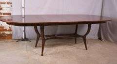 Oval mahogany dining table with 2 skirted leaves; 68-6585A