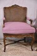 Pair of carved French style open armchairs with cane seats and backs; 68-6922