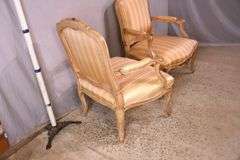 Pair of carved French style open armchairs with striped fabric; 68-6881