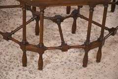 Mahogany octagonal glass top coffee table with cane-cut legs and stretchers; 68-6514