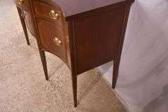 Baker inlaid mahogany serpentine front sideboard; 68-6955