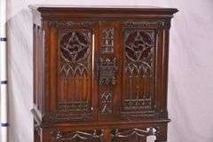 Lightolier carved oak gothic style radio cabinet; 68-6907