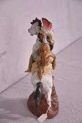 Ceramic Native American on horse statue; 17216-151