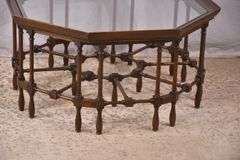 Mahogany octagonal glass top coffee table with cane-cut legs and stretchers; 68-6514