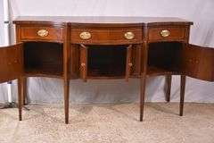 Baker inlaid mahogany serpentine front sideboard; 68-6955