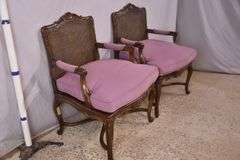 Pair of carved French style open armchairs with cane seats and backs; 68-6922