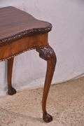 Carved mahogany flip-top table; 74-12753