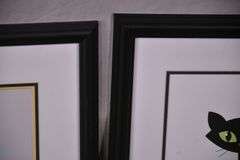 Two framed mid-century style atomic cat prints; 975-1809