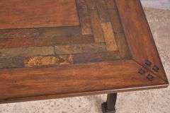 Large trestle base coffee table with slate tile accents on top; 21-2716