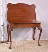 Carved mahogany flip-top table; 74-12753