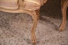 Pair of carved French style open armchairs with striped fabric; 68-6881