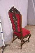 Carved oak high back accent chair with ornate stretcher base; 74-12804