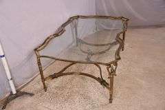 Large gold metal coffee table with glass top; 68-6890
