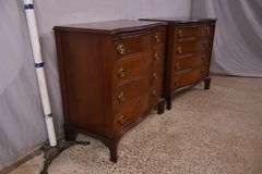 Pair of mahogany serpentine front 4 drawer bachelor's chests with brushing slides; 68-6916