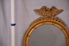 Round porthole mirror with gold eagle frame; 68-6820