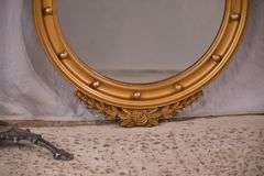 Round porthole mirror with gold eagle frame; 68-6820