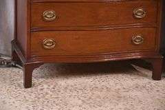Pair of mahogany serpentine front 4 drawer bachelor's chests with brushing slides; 68-6916