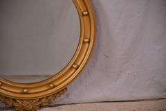 Round porthole mirror with gold eagle frame; 68-6820